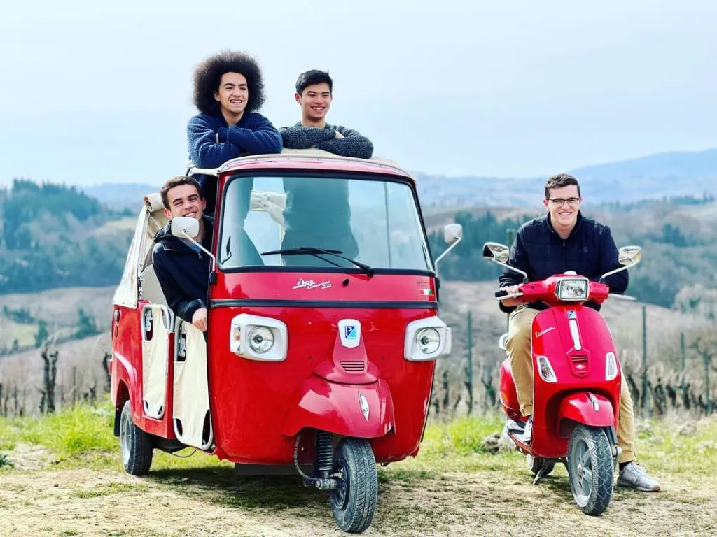 Friends Having A Tuk Tuk Excursion In Tuscany