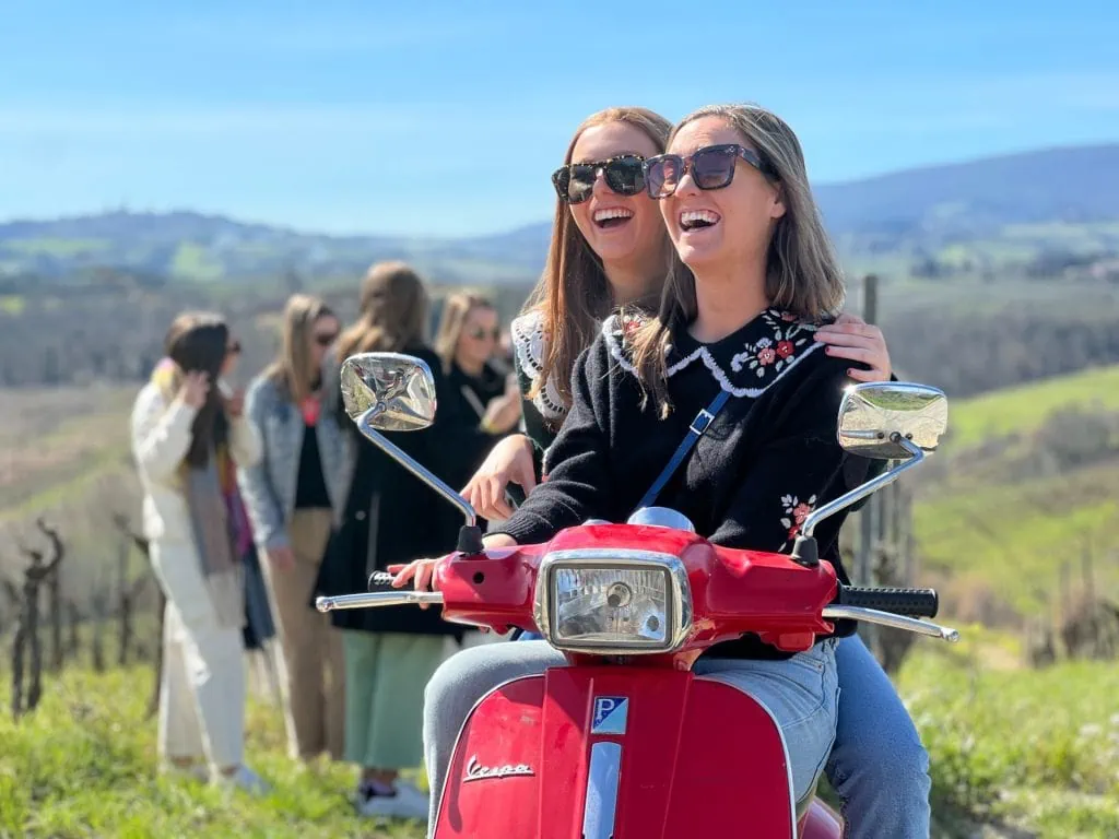 Girls Having Fun With A Vespa Tour